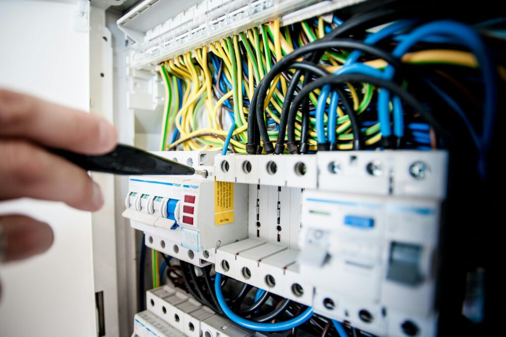 An electrician is working on a distribution box.